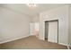 Bedroom with carpet, neutral walls, and ample closet space at 945 Eugene St, Indianapolis, IN 46208