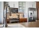 Modern kitchen with stainless steel appliances and granite countertops at 1 Virginia Ave # 606, Indianapolis, IN 46204