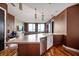 Open concept kitchen with island and stainless steel appliances at 1 Virginia Ave # 606, Indianapolis, IN 46204