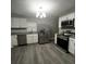 Modern kitchen featuring stainless steel appliances and granite countertops at 815 W 22Nd St, Anderson, IN 46016