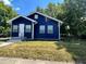 Newly renovated blue house with a well-maintained lawn at 815 W 22Nd St, Anderson, IN 46016