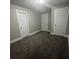Spacious bedroom with neutral carpeting and double closets at 815 W 22Nd St, Anderson, IN 46016