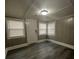 Bright and airy front room with new flooring and blinds at 815 W 22Nd St, Anderson, IN 46016
