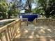 Wooden deck overlooking a backyard with a blue shed at 815 W 22Nd St, Anderson, IN 46016