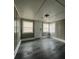 Spacious front room with neutral wall tones and vinyl flooring at 815 W 22Nd St, Anderson, IN 46016