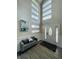 Bright entryway with wood-look floors, bench, and an elegant front door at 808 E Minnesota St, Indianapolis, IN 46203