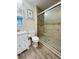 Bathroom with a large walk-in shower and modern white vanity at 808 E Minnesota St, Indianapolis, IN 46203