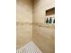 Clean shower with neutral tile and a decorative accent border at 808 E Minnesota St, Indianapolis, IN 46203