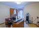 Multi-purpose room with wood desk, water cooler, and exterior access at 2129 Woodcrest Rd, Indianapolis, IN 46227