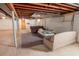 Unfinished basement with open area and storage space at 2129 Woodcrest Rd, Indianapolis, IN 46227
