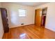 Simple bedroom with hardwood floors and a large closet at 2129 Woodcrest Rd, Indianapolis, IN 46227