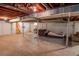 Partially finished basement with open space and a couch at 2129 Woodcrest Rd, Indianapolis, IN 46227
