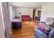 Spacious living room with hardwood floors and ample natural light at 2129 Woodcrest Rd, Indianapolis, IN 46227