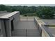 Private rooftop deck with composite decking and metal railing at 98 E Wayne St # D, Franklin, IN 46131