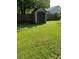 Tan plastic shed in a grassy backyard setting at 643 Pratt St, Greenfield, IN 46140