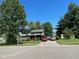 Ranch-style home with carport and well-maintained lawn at 643 Pratt St, Greenfield, IN 46140