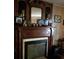 Ornate wooden fireplace mantel in living room at 643 Pratt St, Greenfield, IN 46140