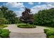 Landscaped circular driveway leading to a luxurious home at 11101 W Hawthorn Rdg, Fishers, IN 46037