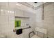 Walk-in shower with tiled walls and built-in seat at 9650 Shasta Dr, Fishers, IN 46038