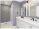 Modern bathroom with double vanity and marble shower at 1136 W 35Th St, Indianapolis, IN 46208