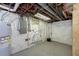 Unfinished basement with plumbing, electrical panel, and water heater at 1136 W 35Th St, Indianapolis, IN 46208