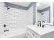 Clean bathroom with white subway tile and black fixtures at 1136 W 35Th St, Indianapolis, IN 46208