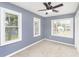 Spacious bedroom with neutral walls and ceiling fan at 1136 W 35Th St, Indianapolis, IN 46208