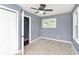 Bright bedroom with neutral walls and ceiling fan at 1136 W 35Th St, Indianapolis, IN 46208