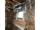 Bathroom under renovation, showing exposed framing and window at 6380 E 10Th St, Indianapolis, IN 46018