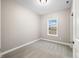 Simple bedroom with neutral wall and carpet flooring, and a window with natural light at 3368 Johns Way, Greenwood, IN 46143