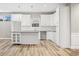 Modern kitchen with white cabinets and granite island at 3368 Johns Way, Greenwood, IN 46143