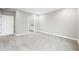 Neutral-toned bedroom with carpet flooring and a view into the adjacent bathroom at 3368 Johns Way, Greenwood, IN 46143