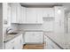 Modern kitchen with white cabinets, granite counters, and sink at 3368 Johns Way, Greenwood, IN 46143