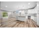 Modern kitchen with white cabinets, granite counters, and island at 3368 Johns Way, Greenwood, IN 46143