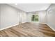 Finished basement featuring LVP flooring and a sliding glass door leading to the backyard at 3368 Johns Way, Greenwood, IN 46143