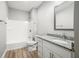 Clean bathroom with a shower/tub combo and granite countertop vanity at 3368 Johns Way, Greenwood, IN 46143