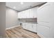 Laundry room with white cabinets and granite countertops at 3368 Johns Way, Greenwood, IN 46143