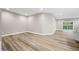 Spacious finished basement with LVP flooring and sliding glass door access to backyard at 3368 Johns Way, Greenwood, IN 46143