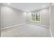 Bright bedroom with neutral walls and carpet flooring, featuring a large window at 3368 Johns Way, Greenwood, IN 46143