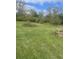 Spacious lot with overgrown areas at 3124 N Gale St, Indianapolis, IN 46218