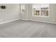 Spacious bedroom with grey carpet and large window at 4756 Bethel Creek Blvd, Indianapolis, IN 46239