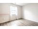 Bright bedroom with hardwood floors and window at 4130 Robertson Ct, Indianapolis, IN 46228