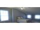 Cozy bedroom with double bed, ceiling fan, and multiple windows at 5959 Sugar Grove Rd, Plainfield, IN 46168