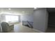 Spacious loft area with seating, natural light, and staircase at 5959 Sugar Grove Rd, Plainfield, IN 46168