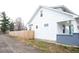 Side view of charming house with new wood fence at 1215 E Kelly St, Indianapolis, IN 46203