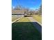 Gravel driveway and grassy yard at 6104 Madison Ave, Indianapolis, IN 46227
