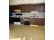 Kitchen with wood cabinets and appliances at 6104 Madison Ave, Indianapolis, IN 46227