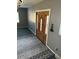 Entryway with wood door and patterned rug at 6104 Madison Ave, Indianapolis, IN 46227