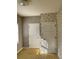 Simple bedroom with neutral walls, carpet flooring and two doors at 6104 Madison Ave, Indianapolis, IN 46227