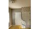 Simple bedroom with neutral walls, carpet flooring and two doors at 6104 Madison Ave, Indianapolis, IN 46227